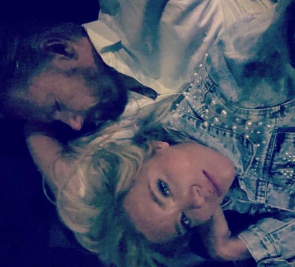 Cindy Curler and her husband Bob Curler lay on a couch in the garage office of the limousine after their wedding in Lahaina, Hawaii on Wednesday. The Pittsburgh couple were unable to get back to their Lahaina hotel Tuesday on their wedding night as wildfires swallowed the town. Their driver was forced to take them to the garage where he parks his limousine.